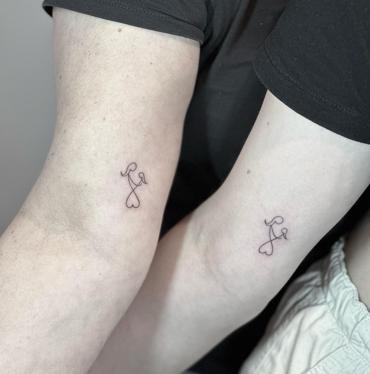 mother daughter symbol tattoo