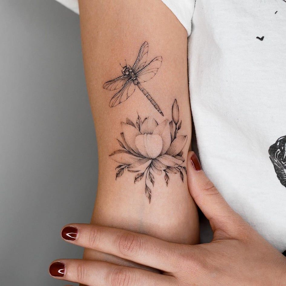 dragonfly on flower tattoo