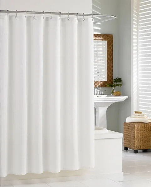 white fabric shower curtain