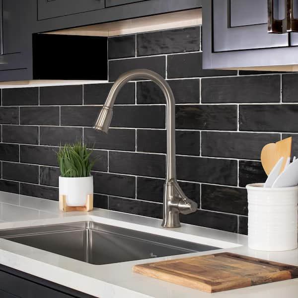 black subway tile backsplash