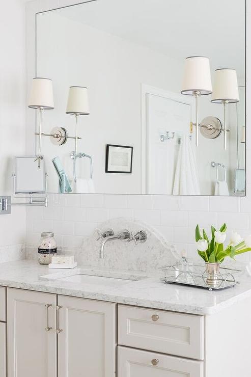 sconces on bathroom mirror