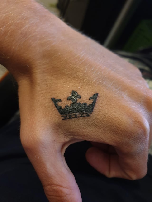 crown tattoo on hand