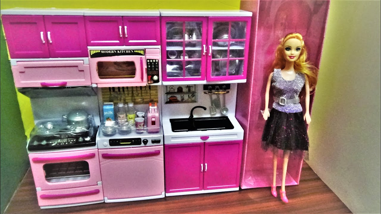 barbie doll and kitchen set