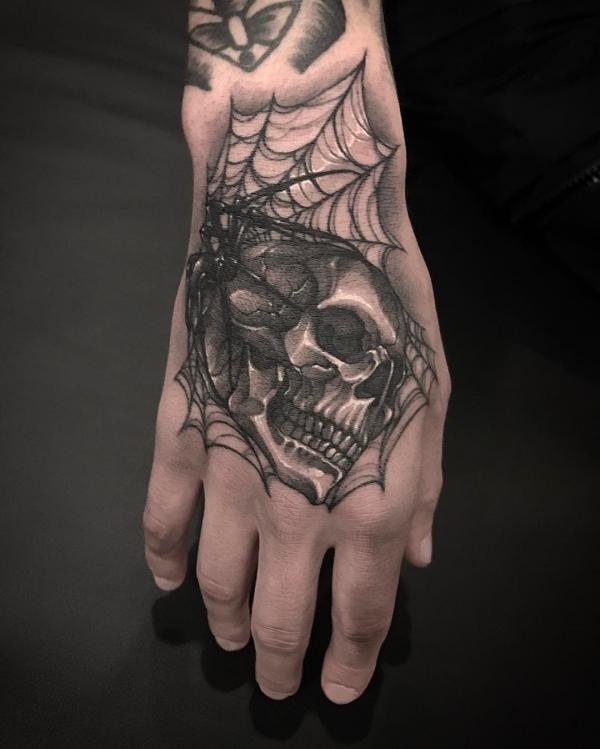 spider web hand tattoo meaning