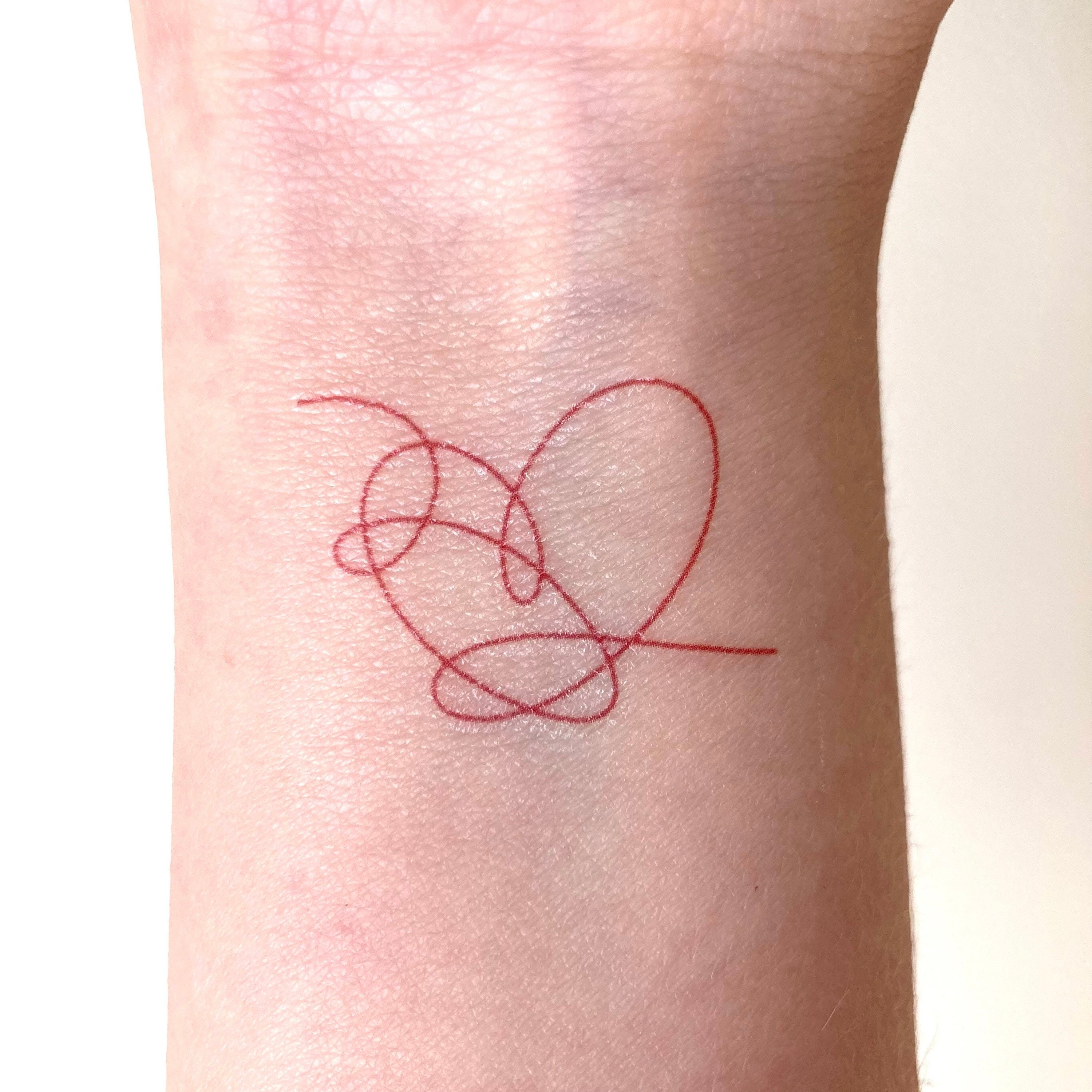 corazon de bts tatuaje