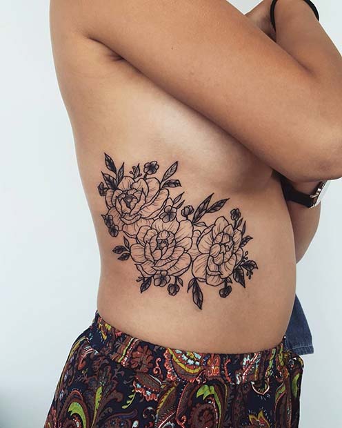 floral rib tattoo