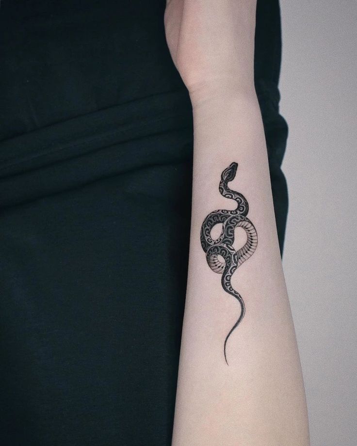 black small snake tattoo