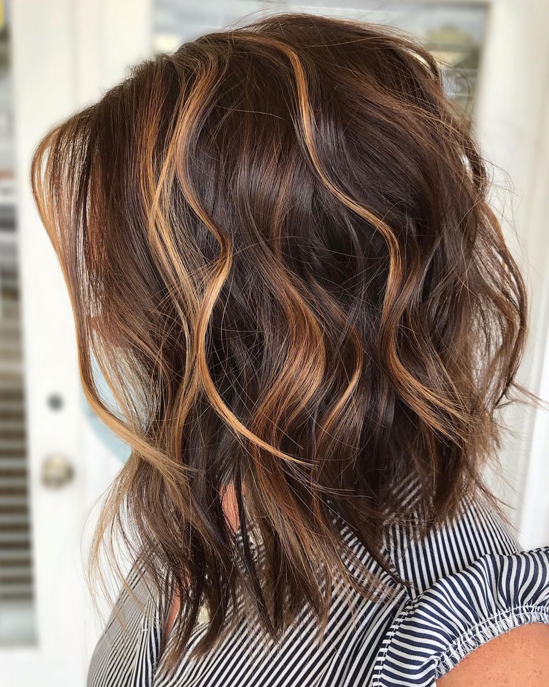 dark brown hair with caramel highlights