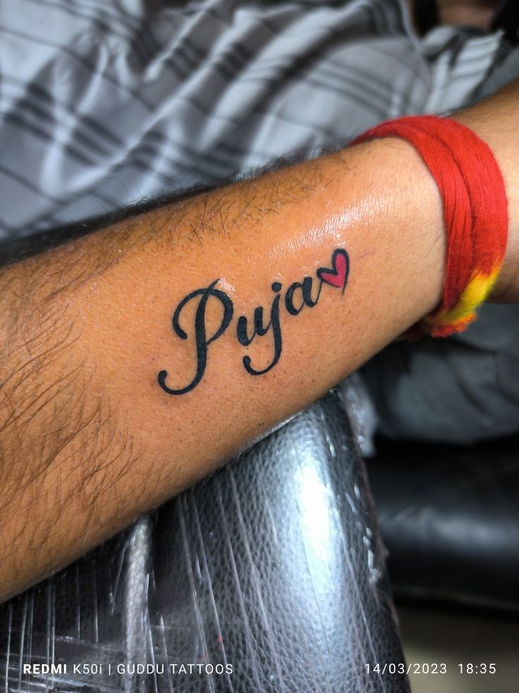pooja name tattoo in hand