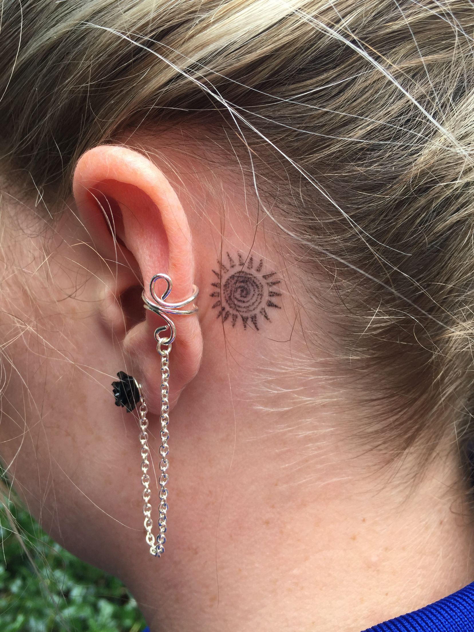 sun ear tattoo