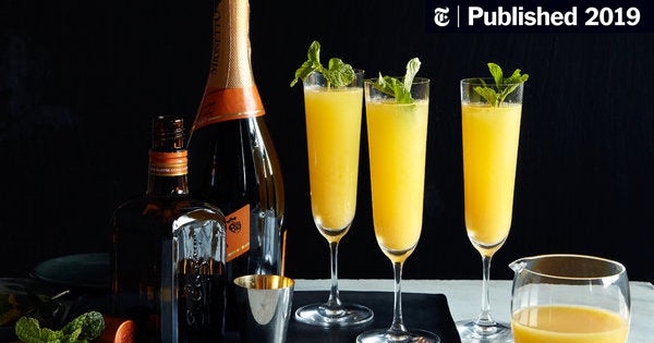 champagne and orange juice cocktail crossword clue