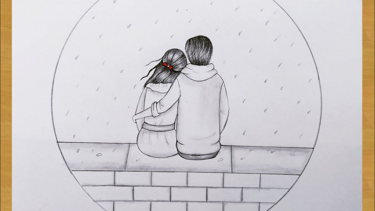 couple sitting together drawing