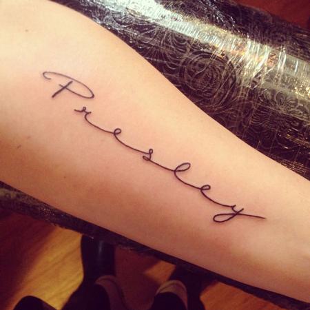 cursive name tattoos