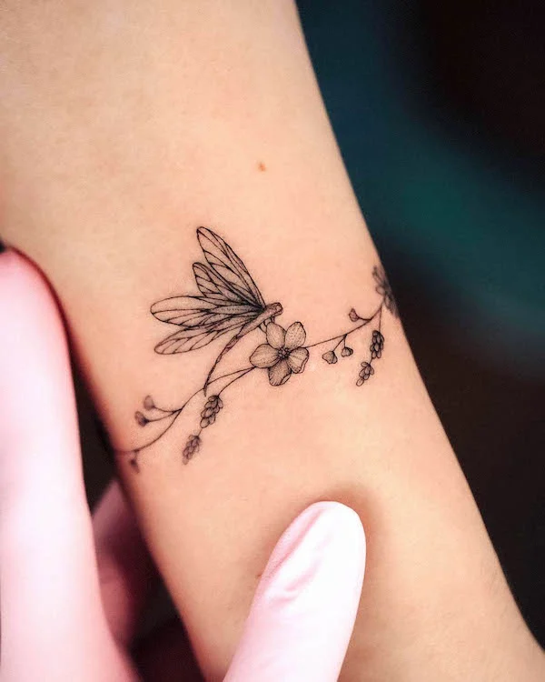 dragonfly on a flower tattoo
