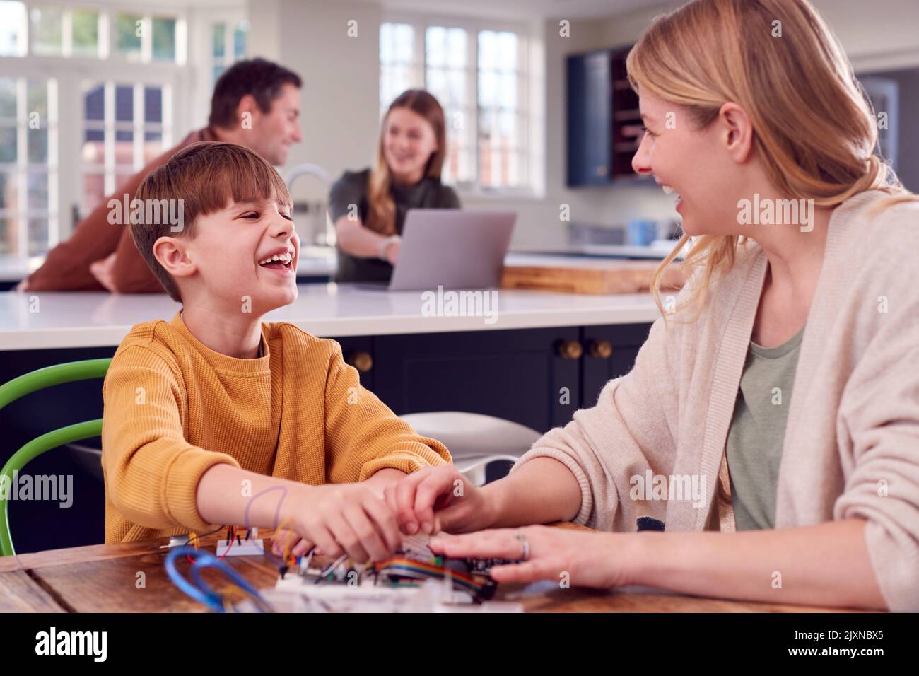 mom helps son with project