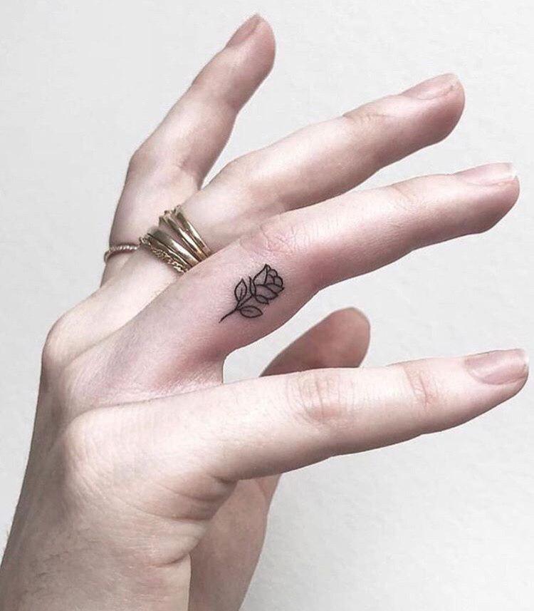 rose finger tattoo