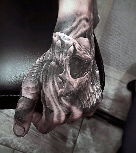 skull hand tattoo