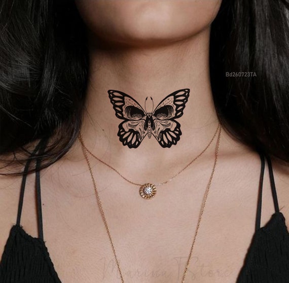 tatuaje de mariposa con calavera