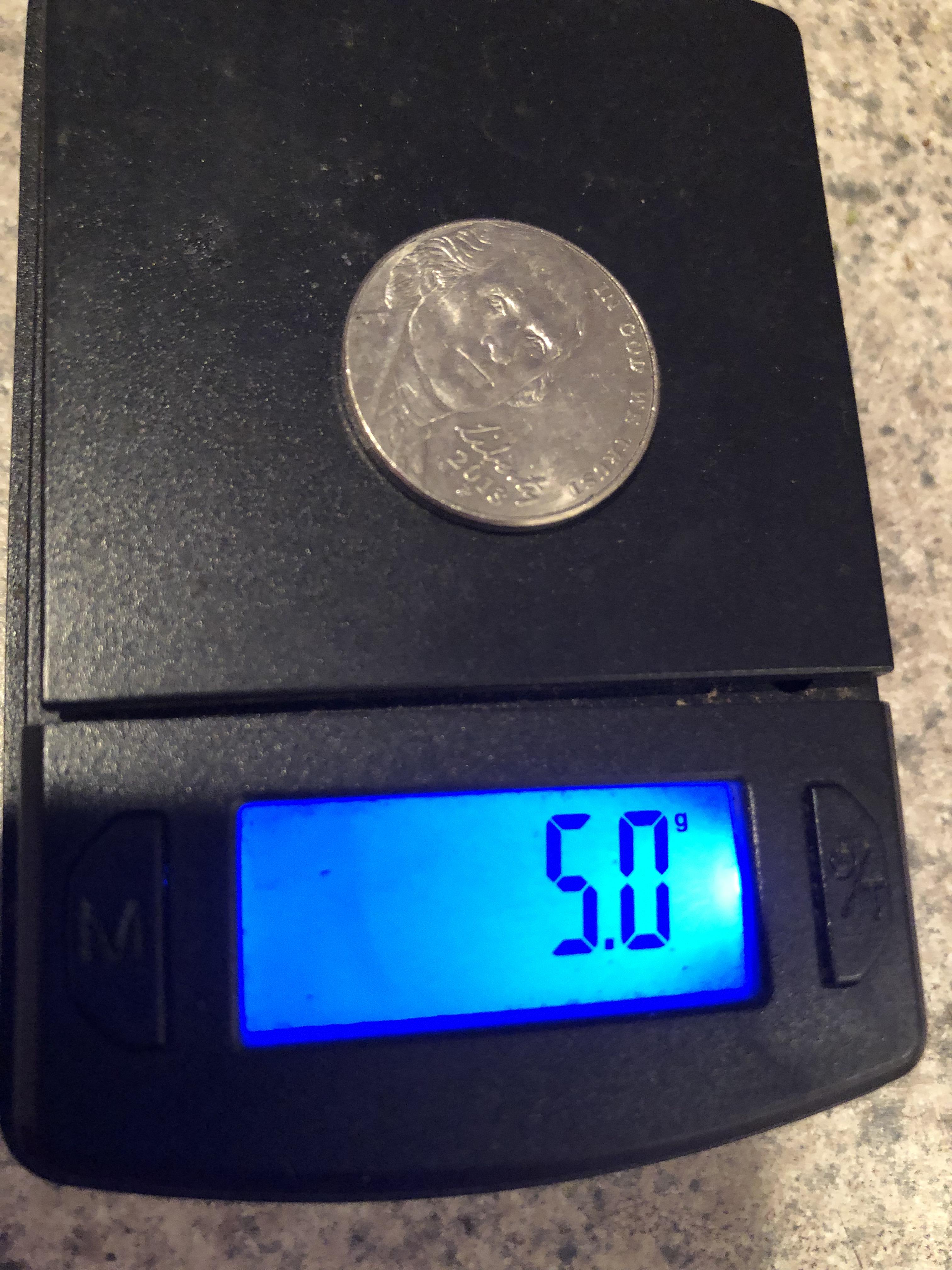 what does a nickel weigh in grams